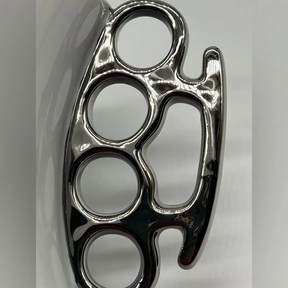 Brass knuckles coffee mug white and silver
